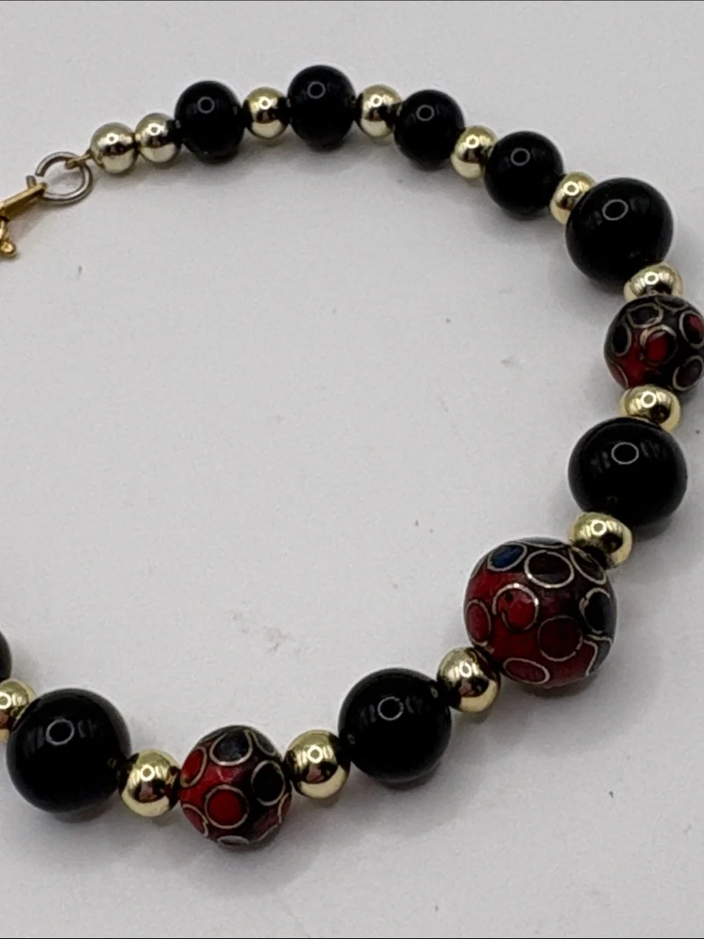 Gold Accent Black Bead Bracelet with Red Cloisonné Beads 7.5”